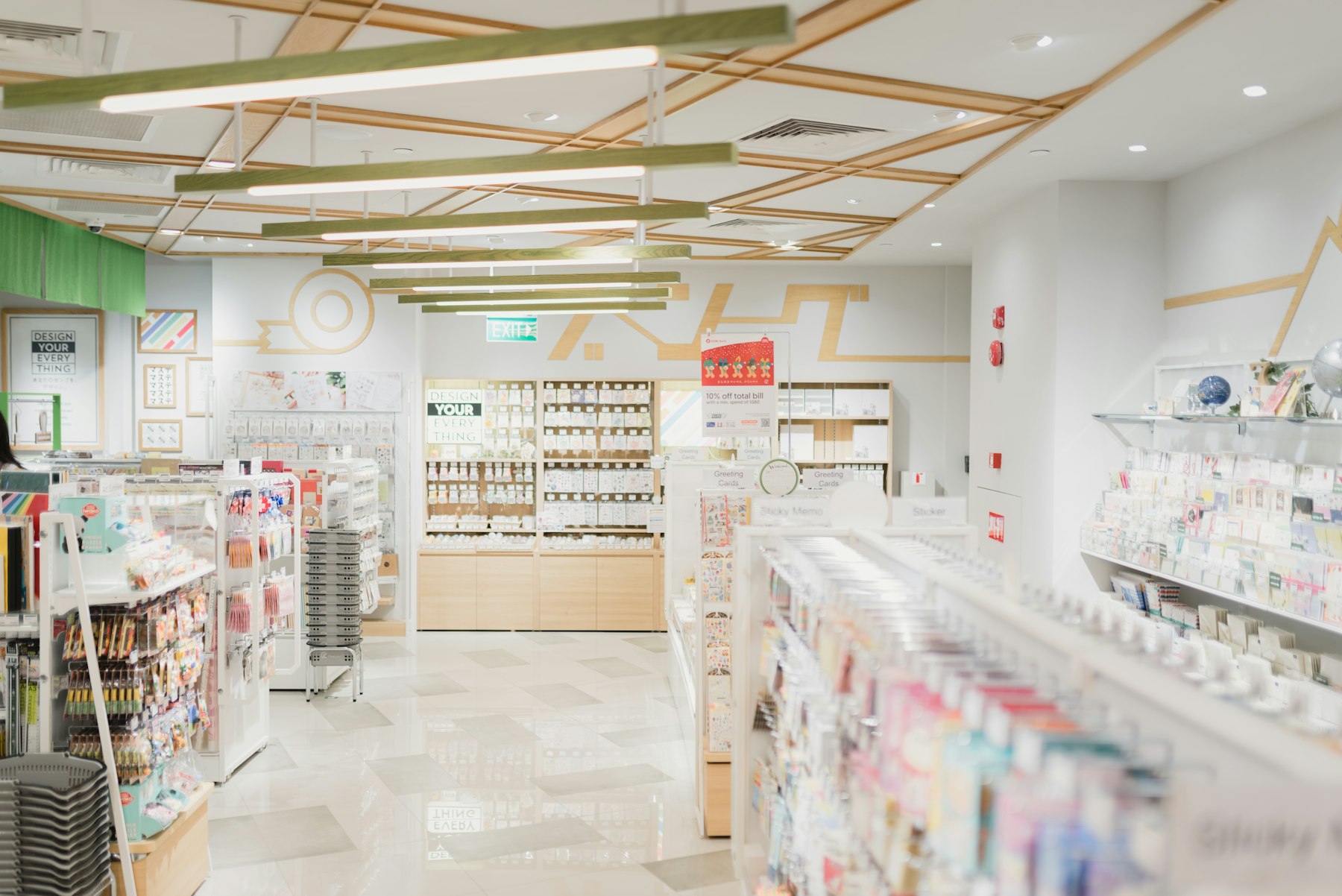 Pharmacist in a white coat reviewing medication bottles on a pharmacy shelf
